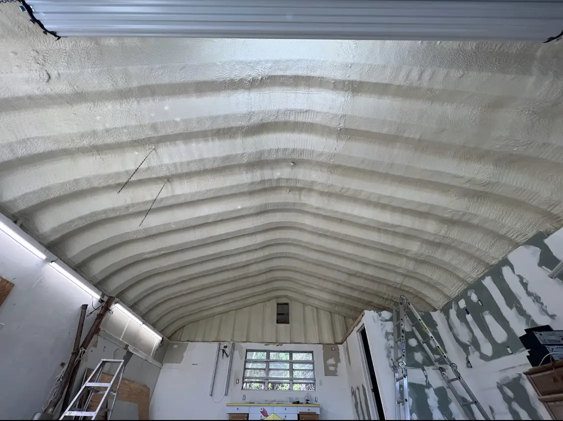 Spray polyurethane foam applied to the underside of a metal roof deck in Hartsville